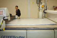 Gerber technology fully computerized cutting system cuts fabric.